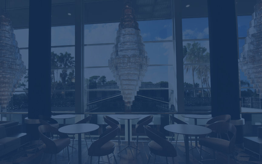 high top tables and chandelier in the lexus lounge